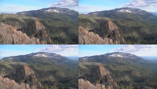 无人机俯瞰城堡岩石山峰与大雪山在塔霍湖背景，加利福尼亚高清在线视频素材下载