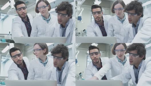 多民族学生在化学实验室使用笔记本电脑的研究高清在线视频素材下载