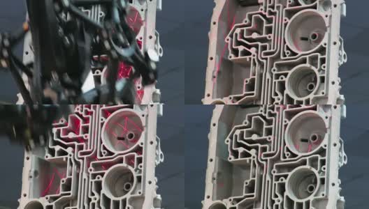 自动机器人手臂执行三维激光扫描一个复杂的内部铸造汽车发动机块，以产生一个计算机模型的件。高清在线视频素材下载