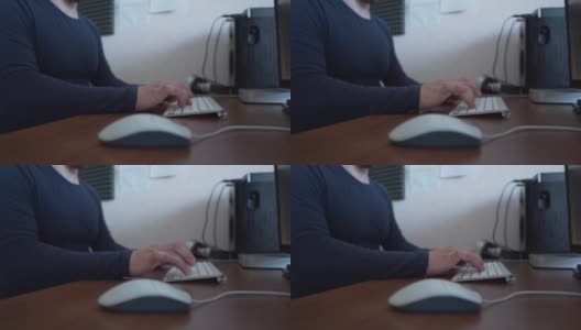 男性商人的手专业用户工作者使用键盘上打字坐在家庭办公桌旁与PC软件应用技术概念在线工作，近端视图高清在线视频素材下载