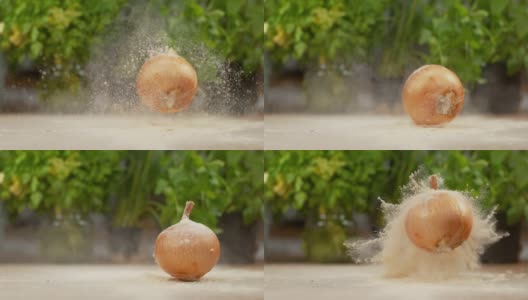 慢镜头:未去皮的洋葱从木桌上弹下来，撒了一地面粉。高清在线视频素材下载
