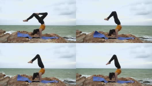 4k/年轻的亚洲苗条女子瑜伽在日落的海滩上，日出的背景。健身、运动、瑜伽和健康理念。高清在线视频素材下载