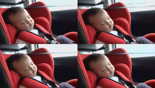 在汽车安全座椅上睡觉的婴儿。亚洲女孩在开车时在汽车座椅上打盹。高清在线视频素材下载