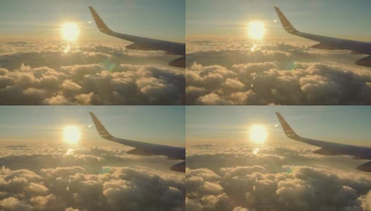 美丽的金色日落日出飞行与太阳光束和飞机机翼高清在线视频素材下载