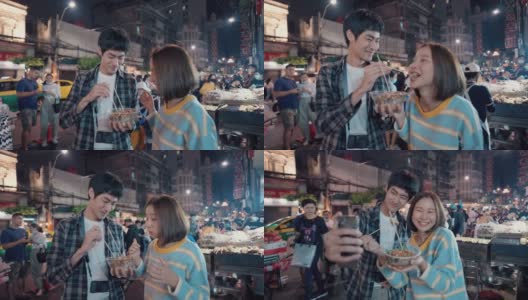 年轻的亚洲夫妇在曼谷唐人街约会高清在线视频素材下载