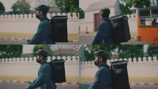 男人骑着踏板车送食物高清在线视频素材下载