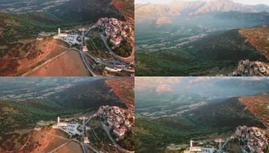 法国科西嘉山脉一座小山上的小镇。无人机飞过城市上空高清在线视频素材下载