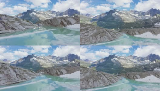 阿尔卑斯山景观的超断层。女人张开双臂在山峰之间的绿松石湖。高清在线视频素材下载
