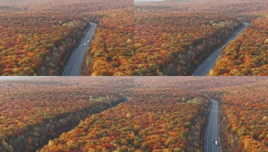 山上的公路在清晨，在日落之后，在五彩缤纷的秋天季节。空中无人机视频与平移摄像机运动。高清在线视频素材下载