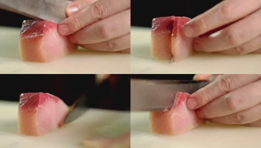 在日本餐厅的厨房酒吧，厨师正在切滨町生鱼片高清在线视频素材下载