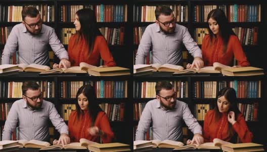 一个男人和一个女人在图书馆看书准备考试高清在线视频素材下载
