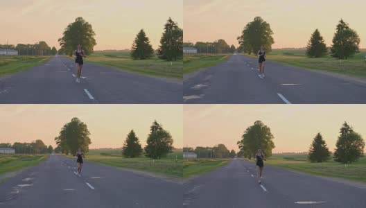 年轻的跑步者穿着运动服在马路上跑着高清在线视频素材下载
