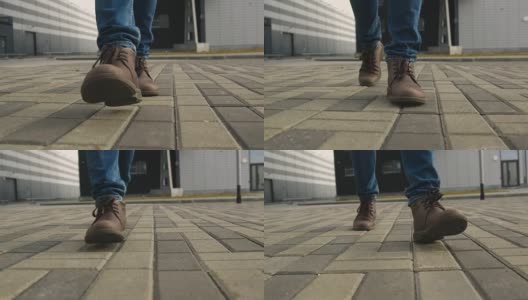 穿鞋的男人走在人行道上的特写镜头高清在线视频素材下载