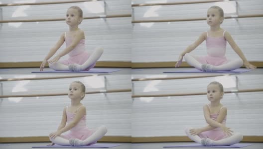 小女孩正在芭蕾舞学校室内练习高清在线视频素材下载