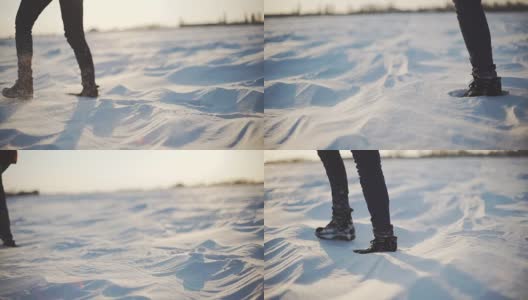 近距离的女人的脚走在雪沙漠在日落。Stabiblized慢动作镜头高清在线视频素材下载