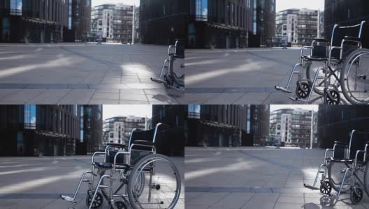 残疾人轮椅在现代建筑附近滚动高清在线视频素材下载