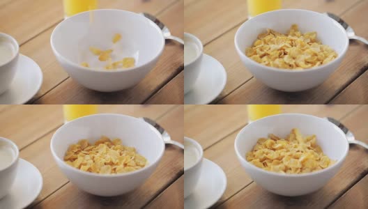 玉米片倒在木桌上的碗里高清在线视频素材下载