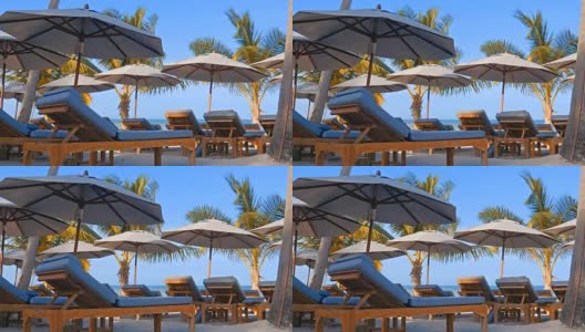 4K伞和椅子与美丽的海滩和大海高清在线视频素材下载