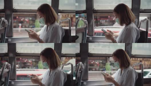 在上班的公交车上，一个戴着面具的女人高清在线视频素材下载