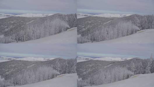 雪机在滑雪坡上爆破人工雪，为滑雪季节的开始做准备高清在线视频素材下载