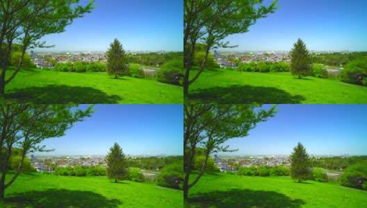 从山上的春天公园看住宅区，山上有美丽的新绿高清在线视频素材下载