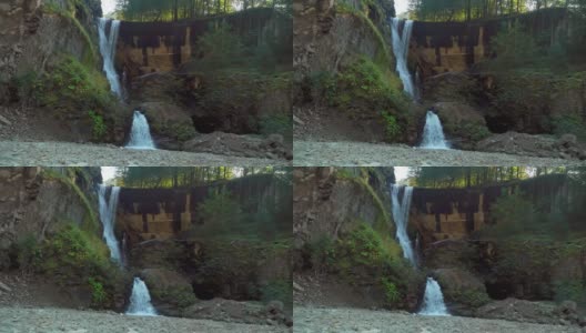 野生森林中的神奇瀑布。美妙的瀑布和淡水，高清在线视频素材下载