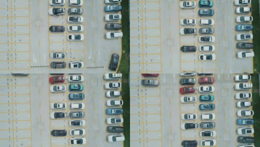 从空中俯瞰，停车场里停满了不同颜色的汽车。相机向前移动高清在线视频素材下载