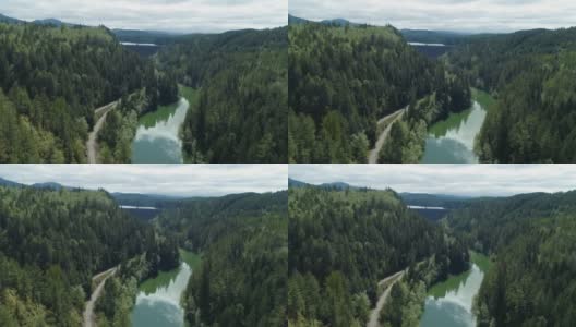 空中飞向拦湖河上的大坝高清在线视频素材下载