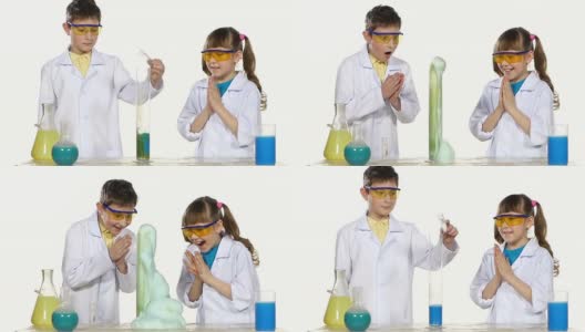 两个可爱的化学家孩子做有趣和成功的实验与蓝色泡沫孤立在白色背景，慢动作高清在线视频素材下载
