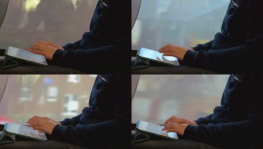 旅行期间在平板电脑上写作的女人高清在线视频素材下载