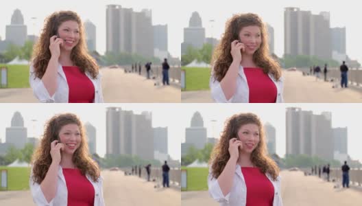 慢镜头女子微笑和使用手机在底特律高清在线视频素材下载