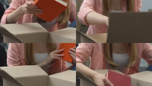 特写的女孩打开箱子与书，搬到学生宿舍的新房间高清在线视频素材下载