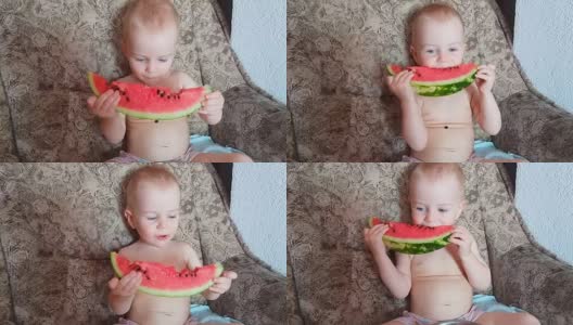 微笑的小男孩吃着西瓜高清在线视频素材下载