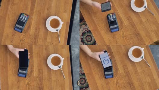 在NFC支付过程中从上面看到的咖啡杯和智能手机。高清在线视频素材下载