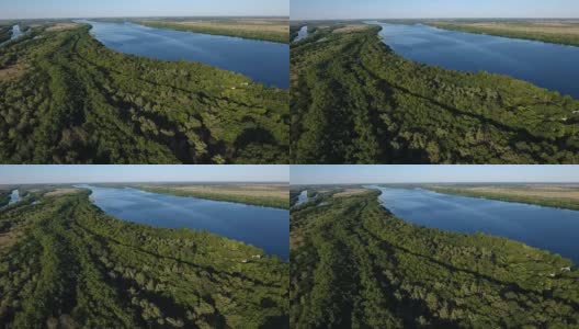 空中拍摄的第聂伯罗河与野生绿色和波光粼粼的蓝色水域高清在线视频素材下载