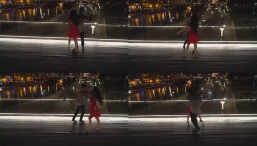 在莫斯科市中心的一座桥上，一男一女正在跳舞。高清在线视频素材下载