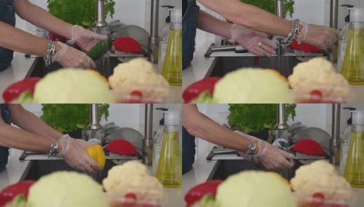 洗蔬菜时戴手套高清在线视频素材下载