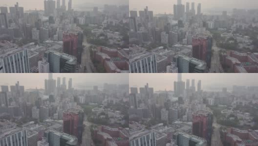 鸟瞰图香港城市景观，城市景观。许多摩天大楼，高大的玻璃建筑，大都市的商业中心，城市生活。混凝土丛林。大都市。大都市。日落烟雾灰色的天空。高清在线视频素材下载