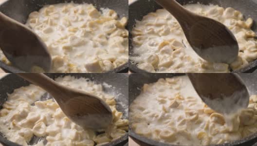 慢动作:在煎锅里翻炒酸奶油饺子、意大利火腿、意大利面高清在线视频素材下载