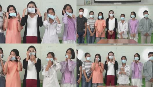 亚洲小学生戴上口罩预防病毒上课开始重开高清在线视频素材下载