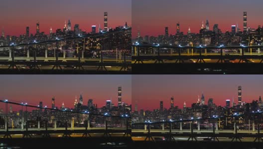曼哈顿中城在夜晚照亮了天际线。RFK桥上的风景和交通。无人机镜头与平移摄像机运动。高清在线视频素材下载