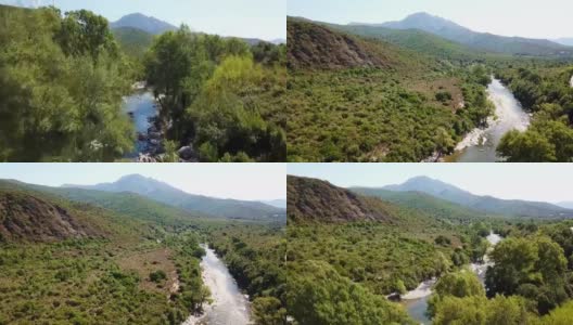 无人机在河上起飞。科西嘉山脉和常青的灌木林-玛其亚可见。法国高清在线视频素材下载
