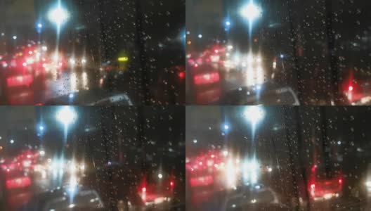 夜景散焦交通与雨。高清在线视频素材下载