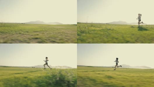 运动员跑步的剪影，一个女跑步者在日落日出。高清在线视频素材下载