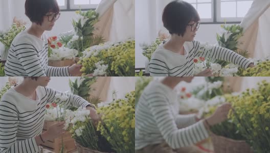 亚洲花匠在花店安排花束高清在线视频素材下载