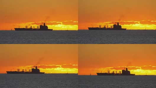 在4k慢镜头的夕阳下，一艘集装箱货轮在海上航行高清在线视频素材下载