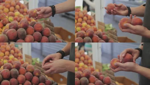 男人白天在蔬菜市场买桃子高清在线视频素材下载