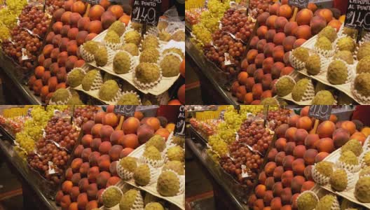 在La Boqueria市场的水果大柜台。巴塞罗那。西班牙高清在线视频素材下载