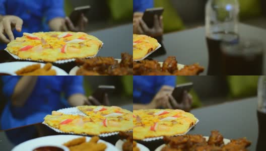 披萨套餐和鸡肉小吃在桌子上作为正餐高清在线视频素材下载