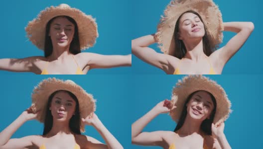 年轻的亚洲妇女戴着草帽享受阳光和飞吻高清在线视频素材下载